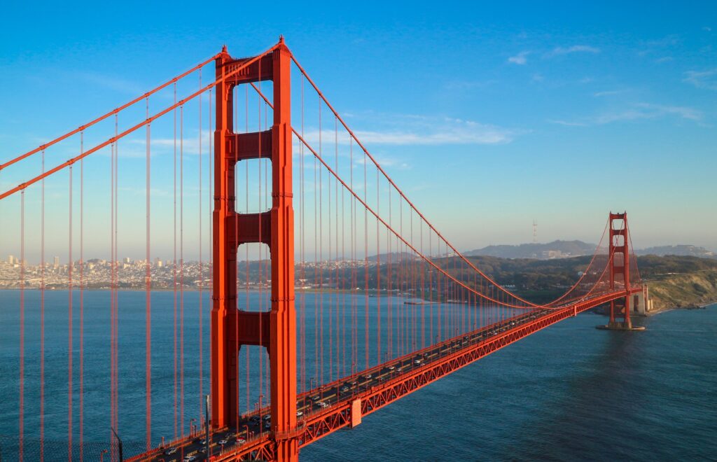 pexels photo 12344491 12344491 A stunning aerial shot of the iconic Golden Gate Bridge in San Francisco against a clear blue sky.